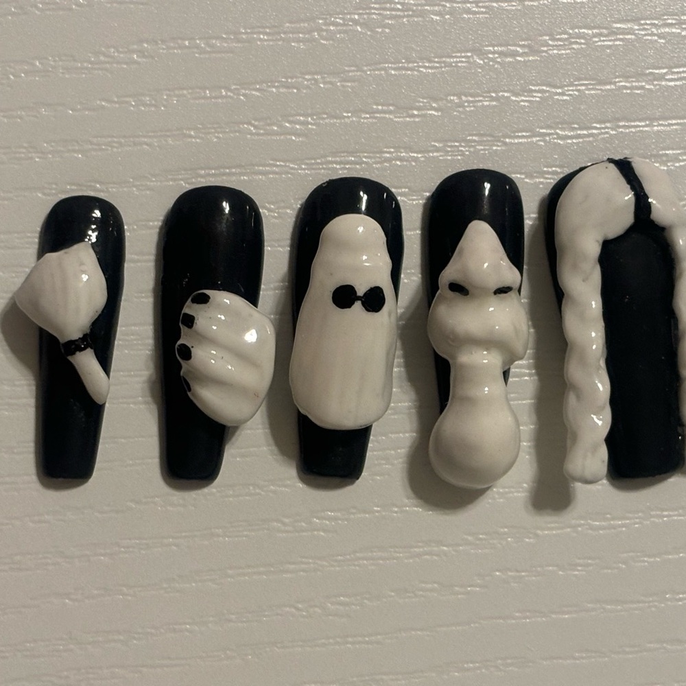 Adam’s family themed press on nails
